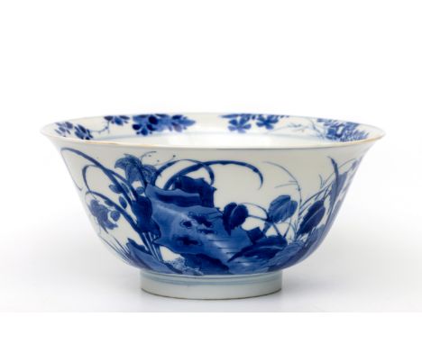 China, a blue and white porcelain bowl, Kangxi period (1662-1722), modelled with flaring sides, the exterior painted with two