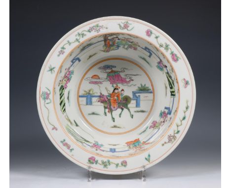 China, famille rose porcelain basin, 20th century, the interior painted with children seated on top of a mythical beast, surr