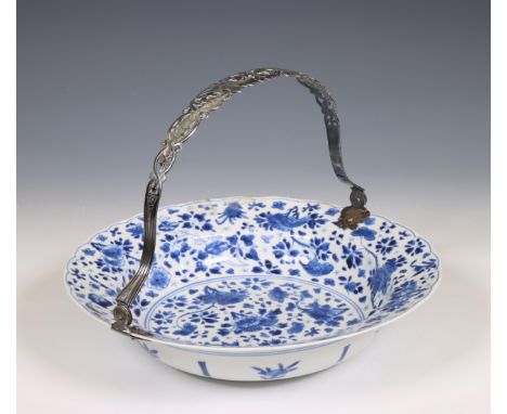 China, a silver-mounted blue and white porcelain plate, Kangxi period (1662-1722), the silver later, the deep plate painted w