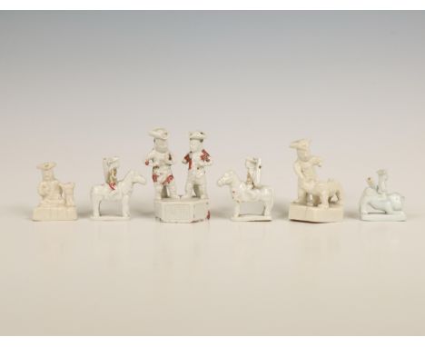 China, six various blanc-de-chine whistles and miniatures, Kangxi period (1662-1722), variously modelled as Dutchmen and vari
