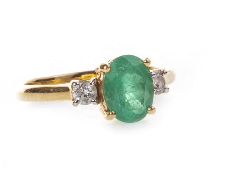 GREEN GEM AND DIAMOND THREE STONE RING, set with a central oval faceted green gem 8.1mm long, marked 750, size O, 2.9g