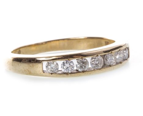 DIAMOND SET HALF ETERNITY RING, with channel set round brilliant cut diamonds totalling approximately 0.22 carats, marked 9K,