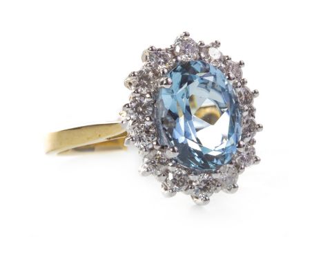 AQUAMARINE AND DIAMOND RING, set with a central oval faceted aquamarine 10mm long and within a diamond border, in eighteen ca