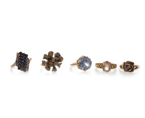 FIVE MID TO LATE TWENTIETH CENTURY RINGS, all marked for gold, including one with a floral motif bi colour bezel, size R 1/2,