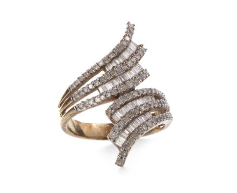DIAMOND CLUSTER RING, the cross over bezel with rows of channel set baguette cut diamonds and round diamonds, unmarked, size 