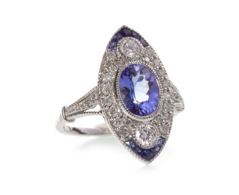 TANZANITE, SAPPHIRE AND DIAMOND RING, the marquise shaped bezel 20.5mm long and with a central millegrain edged collet set ov