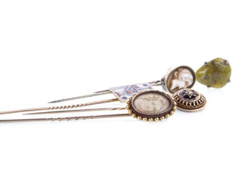 TWO VICTORIAN STICK PINS, one mounted with a cameo, the other with enamel detail and a single diamond; along with three other