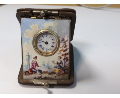 A small enamel decorated travel watch, the leather case marked Aug. Klein, Vienna, the rectangular polychromed enamel frame d
