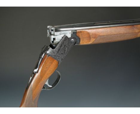 SKB, a model 500 20 bore over/under boxlock ejector gun, No. 563007, the 26" barrels with ventilated top rib, the frame with 