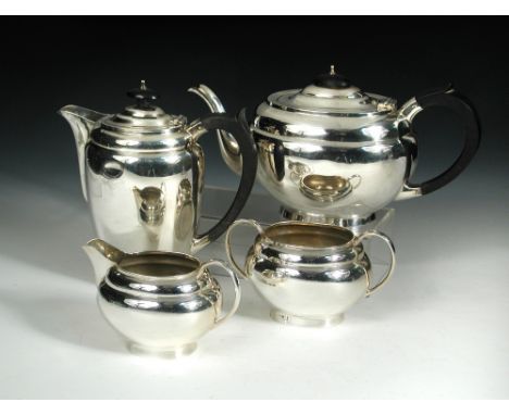 A matched four piece silver teaset, comprising:- a teapot by S Blanckensee & Sons, Birmingham 1938, of plain oval shape with 