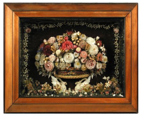 A 19th century framed shell work relief, depicting a central basket of flowers supported on a brace of swans with floral bord