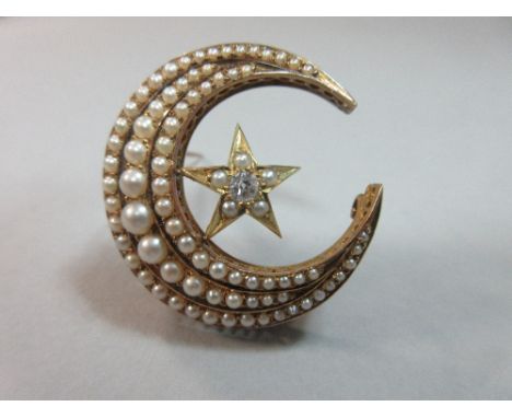 A Victorian pearl and diamond crescent moon and star brooch, the closed crescent set with three graduated lines of 0.5-4.0mm 