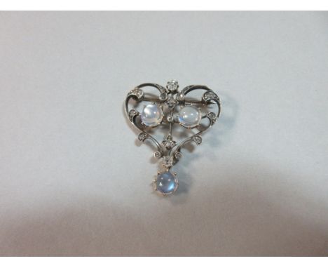 A late 19th or early 20th century moonstone and diamond brooch, designed as a foliate-embellished heart with each leaflet set