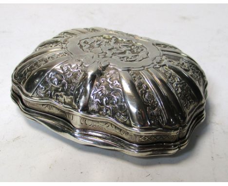 An 18th century French silver snuff box, maker FM, of serpentine form the body and cover cast with panels of figures and flow