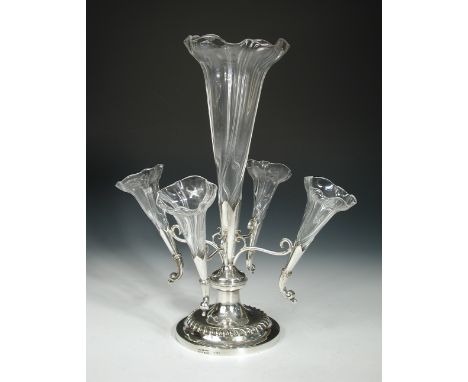 A Victorian electroplate and glass epergne, by William Hutton & Sons, Sheffield, raised from a circular gadrooned base, the c