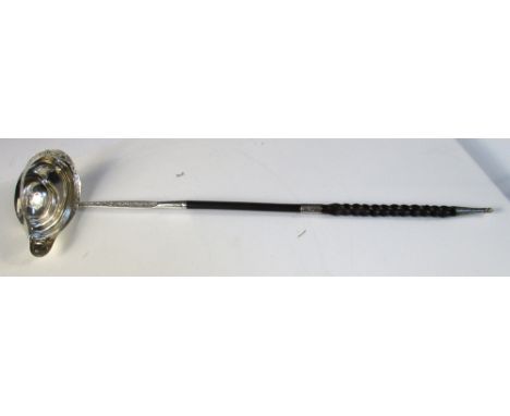 A fine George III silver punch ladle, by Hester Bateman, London 1784, the oval bowl bright cut decorated edge and lip below a