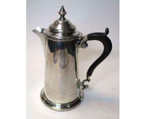 A silver hotwater jug, by Harrison Brothers and Howson, Sheffield 1928, of tapering cylindrical form with moulded spreading f