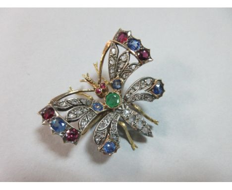 A diamond and multi-gem set butterfly brooch, the pierced wings and abdomen set with rose cut diamonds, the thorax with a rou