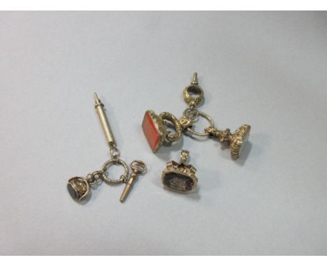 A small collection of gemset fobs and other period pendants, the first fob set with a rectangular white chalecedony intaglio 