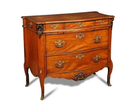 A Transitional style walnut commode, late 19th century, of serpentine outline, with end drawers, brushing slide and two furth