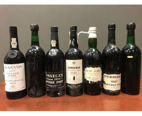 Vintage port. Sandeman 1963, Fonseca 1975, Cockburn 1967, Warre 1970 (x2), Graham 1977, Dow's LBV 1957, (together 7 bottles) 