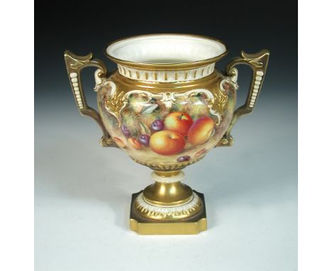 A Royal Worcester two handled vase, the lobed body painted by H. Ayrton with apples and cherries, scrolled gilt handles, on s