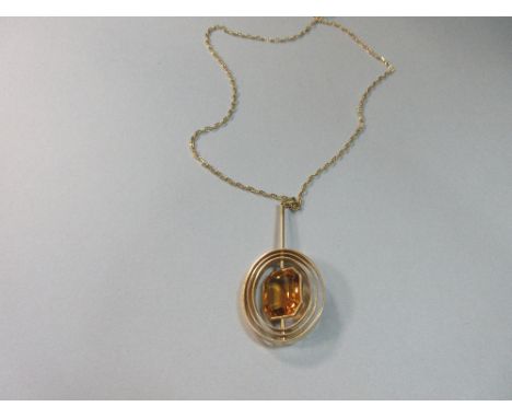 An unusual 1960s citrine pendant with later 18ct gold chain, the octagonal step cut mid-gold citrine collet set in the centre