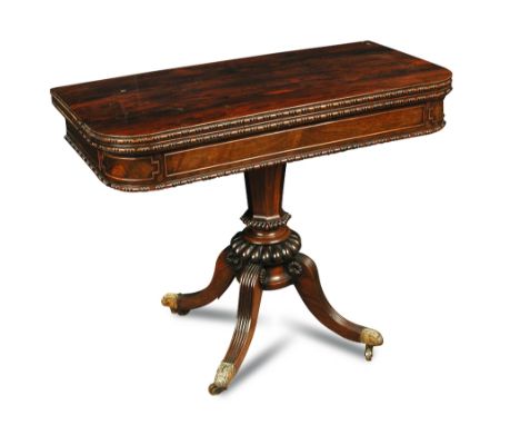 A Regency rosewood pedestal Card Table, with split round border moulding on tapering octagonal column and four swept and reed