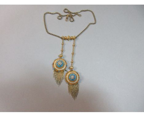 A Victorian Archeological Revival negligée necklace, the curb link back chain set to the front with a geometric feature with 