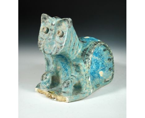 A Raqqa pottery model of a seated cat, Syria, 12th /13th cenury, decorated in black on a turquoise ground body 21 x 22cm (8 x