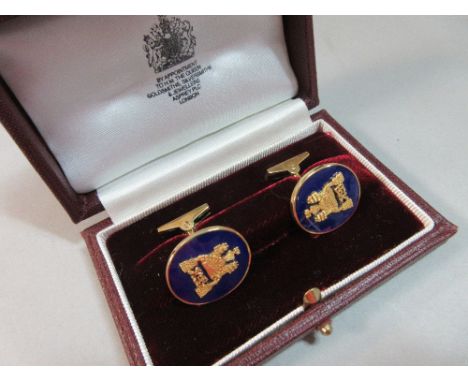 A pair of 18ct gold and enamel cufflinks by Asprey in their original fitted Asprey case, each cufflink with an oval deep blue