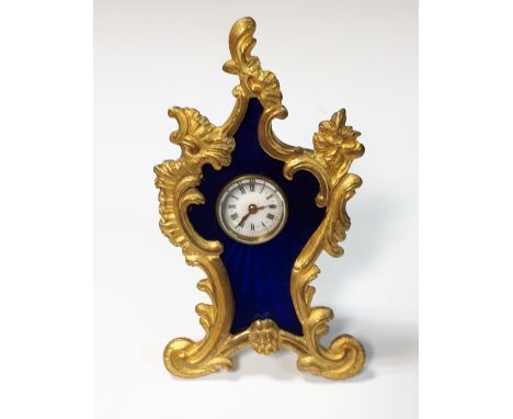 Unsigned - a small French ormolu framed dressing table timepiece, with inset blue enamel ground containing a white enamel dia