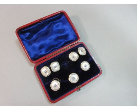 A diamond, mother-of-pearl and enamel gentleman's dress set, the double-ended cufflinks designed as a round brilliant cut dia