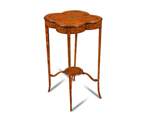 An Edwardian satinwood painted lamp table, the quatrefoil top decorated with floral swags, on slender tapering legs united by