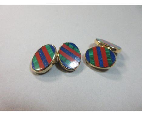 A pair of 18ct gold and coloured hardstone cufflinks, the double-ended links each with a flat oval plaque with diagonal strip