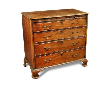 A George III mahogany chest of drawers, with a slide and four long graduated drawers, brass swan neck handles, on ogee bracke