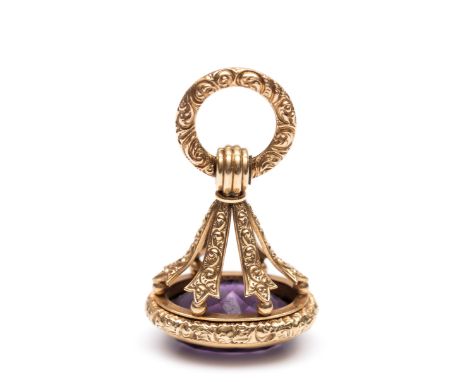 14 kt. Gouden cachet, 19e eeuw, rijkelijk gedecoreerd met krullen en bezet met amethyst, gegraveerd met een stoomtrein bruto 