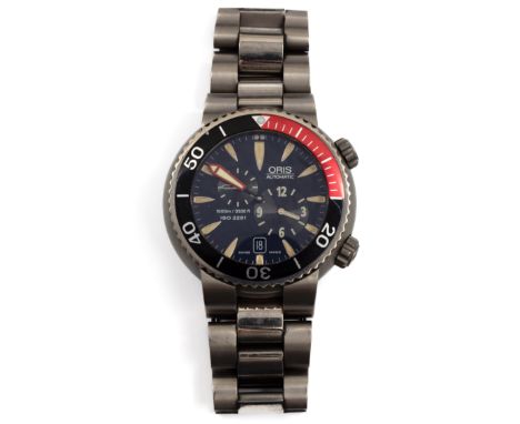 Oris, titanium heren duikhorloge, automaat. Met datumaanduiding, dieptemeter en secondeaanduiding. Loopt niet. Met etui waari