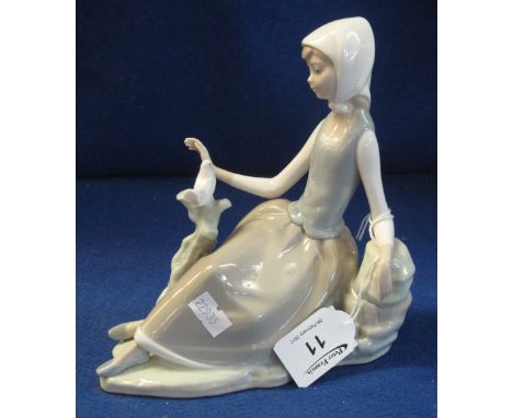Lladro porcelain figure of a reclining young girl with dove on tree stump, glaze blue mark to base with impressed figures.