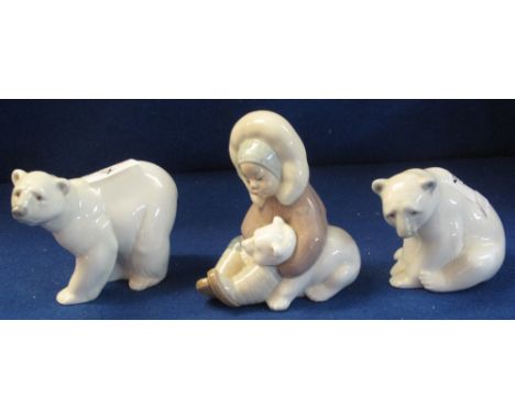 Group of three Lladro porcelain figures, two polar bears and a young Inuit girl with baby polar bear, blue glaze marks to bas