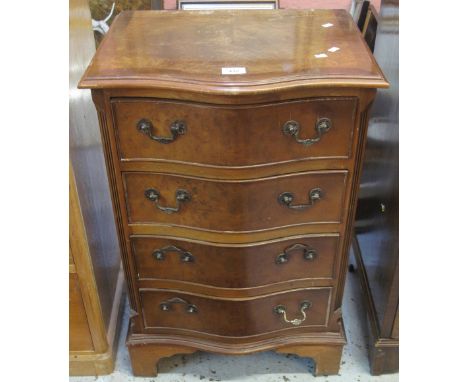 Reproduction walnut serpentine narrow chest of four drawers on bracket feet.