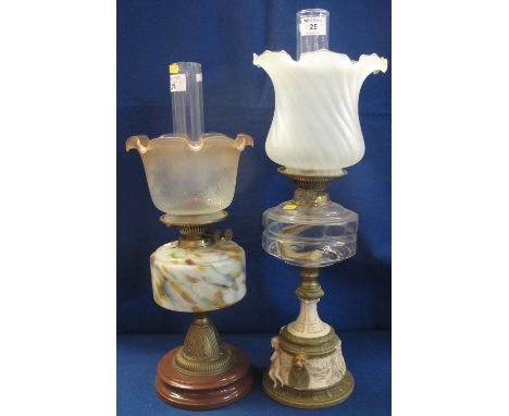 Brass double burner oil lamp with faceted glass reservoir on a Royal Dux Classical design figure mounted ceramic base, having