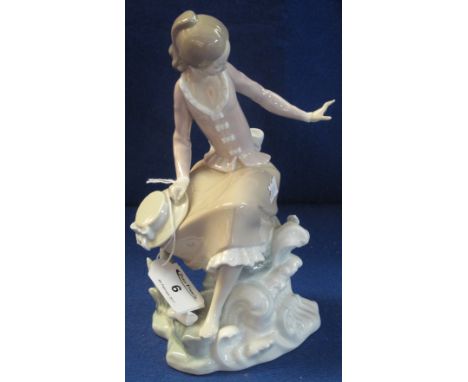 Lladro porcelain figure of a young girl seated on a rock, having lost her shoe, blue glaze mark to base with impressed and sc