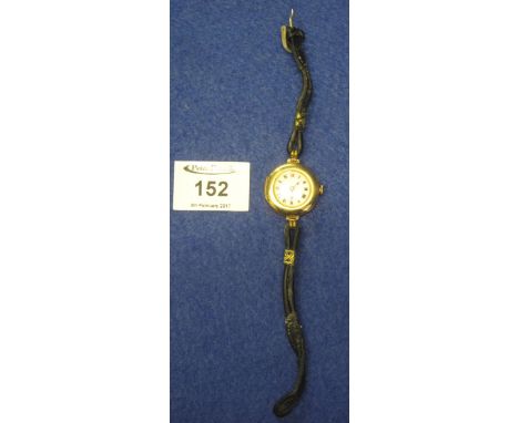 Early 20th Century lady's gold wristwatch with enamel face and leather strap.