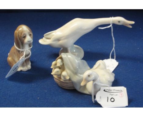 Three Lladro porcelain animals, a duck with basket of ducklings, a seated mournful puppy and a goose with extended neck, all 