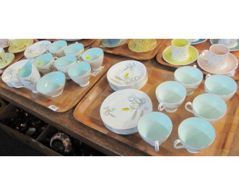 Two trays of Royal Albert bone china 'Festival' tea service comprising: teacups and saucers; side plates; milk jug and sucrie