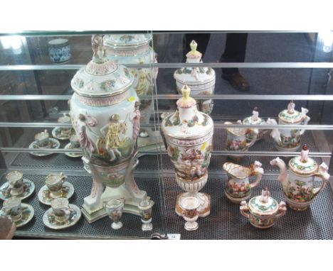 Group of Italian decorative ceramic items to include: large urn and cover; further urn and cover; four piece coffee service w