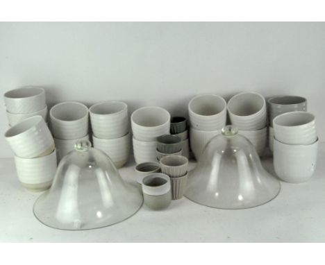 Two vintage glass cloches, heights circa 19 cm and 22 cm, together with a quantity of modern glazed plant pots