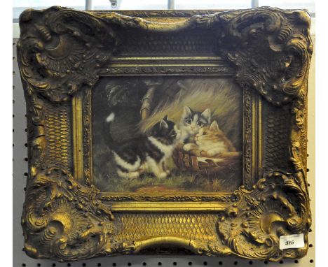 A 20th Century print of cats, in giltwood and gesso frame, 23cm x 19cm