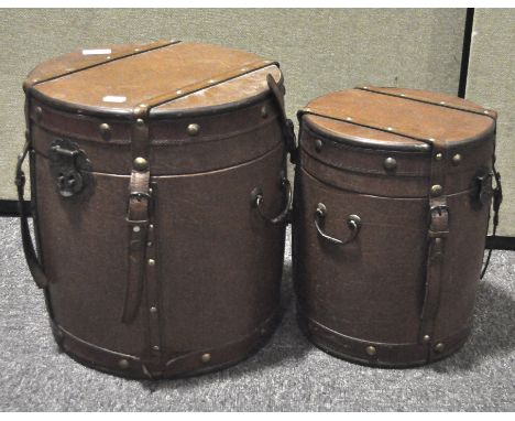 A set of two vintage Chinese drum form wood lined and leather bound boxes and covers, heights 37 cm and 32.5 cm